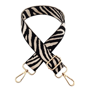 Adjustable wide replacement shoulder strap with black and white zebra pattern and gold hardware