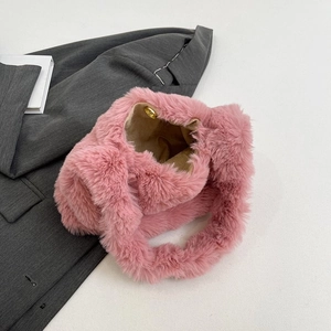 Chic pink faux fur shoulder bag with soft plush texture and magnetic gold closure