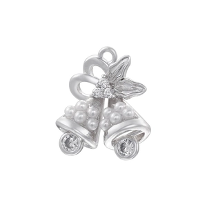 Detail of silver Christmas bell pendant with pearls, crystals and holly leaf bow