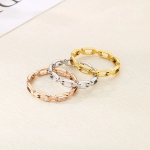 Detailed view of hollow square chain link rings in gold, silver, and rose gold finishes