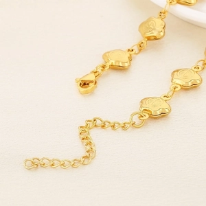 Golden flower pendant bracelet with adjustable extension chain and lobster clasp
