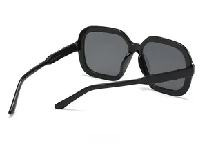 Macro view of oversized square sunglasses showing inner temple specifications and model 5500