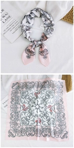 Detailed view of pink baroque floral silk scarf in folded and square-flat display