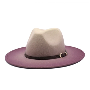 Detail of wool fedora showing gradient tan to purple color and leather band buckle