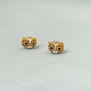Exquisite gold-plated owl stud earrings with white enamel and sparkling rhinestones