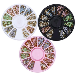 Three circular nail art rhinestone storage wheels in black, white, and pink options