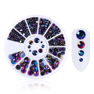Detail of multi-color holographic nail rhinestones in a 12-slot circular organizer case