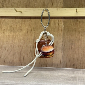 Y2K style woven rope mini bag charm with brown leather bag and hamburger acrylic pendant