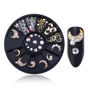 Detail of moon nail art charms with pearls and rhinestones in 12-slot round storage box