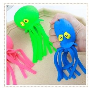 Macro shot of colorful squishy octopus bath toys being squeezed for stress relief