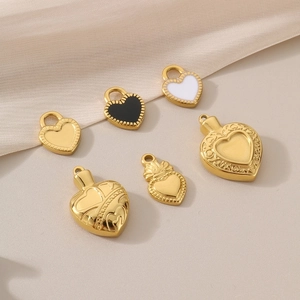 Set of six gold stainless steel heart pendants with black and white enamel details