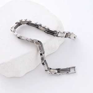 Industrial silver and black stainless steel men's bracelet with watchband texture