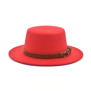 Flat top red wool fedora hat featuring a brown leather band and gold metal buckle detail