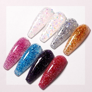 Detail view of 8 glitter nail extension gel colors on long coffin shaped tips