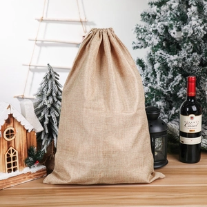 Christmas burlap drawstring gift bag with holiday prints and rustic festive decorations