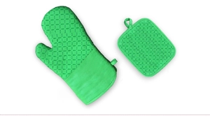 Macro shot of green silicone oven mitt and potholder with non-slip diamond texture