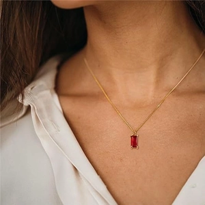 Exquisite 18k gold plated necklace with a red emerald-cut gemstone on female model