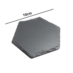 Detail of 10cm hexagonal natural slate coaster with dark grey stone texture