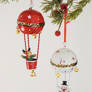 Christmas hot air balloon metal pendant with reindeer and snowman on a pine branch