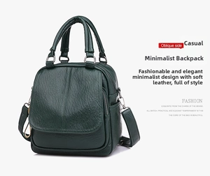 Detail of dark green pebble leather texture on a multi-purpose convertible backpack