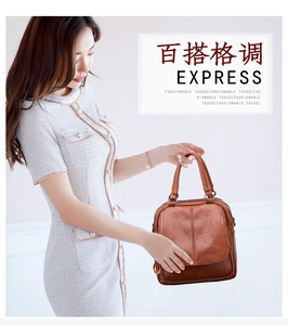 Detailed view of brown leather multifunctional women's handbag with sturdy top handles
