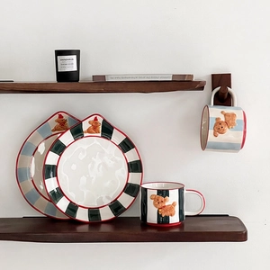 Ceramic mug and plate set featuring 3D party dog motifs and vibrant striped patterns