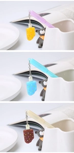Detailed close-up showing cute popsicle pendants in various colors attached to gel pens