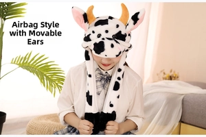 Detail of plush cow hat with moving ears and manual air pump paw controls