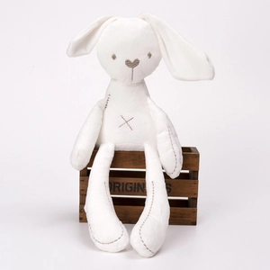 Close-up of white plush bunny with brown embroidered heart nose and soft stitched details