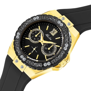 Detail of luxury rhinestone bezel and black silicone strap on gold-toned quartz watch