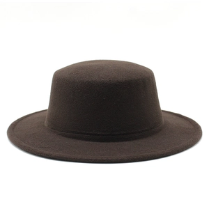 Detailed view of deep brown wool felt boater hat with a flat top and wide stiff brim