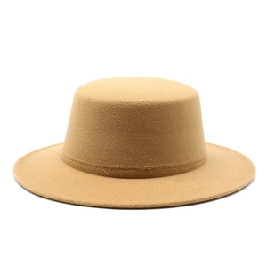 Detailed close-up of the smooth texture and stitching on a camel wool felt flat top hat