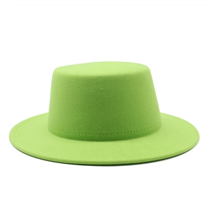 Detail view showing neon green wool felt boater hat texture and stitching craftsmanship