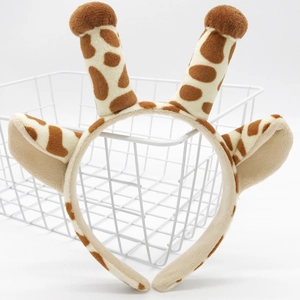 Plush giraffe antler headband with ears for Christmas parties on white background