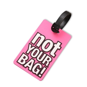 Pink PVC luggage tag with 'not YOUR BAG!' text and black strap on white background
