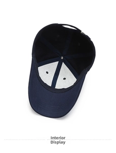 Detail view of cotton baseball cap interior featuring white lining and ventilation eyelets