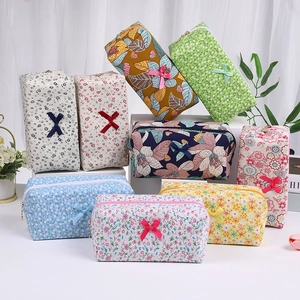 Floral cotton makeup bags with cute bows and zipper closure in various colors