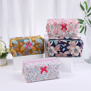 Floral makeup bags with bow details in four patterns for travel storage organizer
