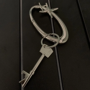Silver star carabiner and key-shaped bottle opener keychain with a metallic finish
