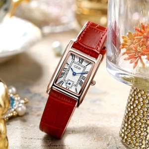 Elegant vintage rectangular gold quartz watch with red leather strap and Roman numerals