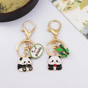 Cute panda metal keychains with bamboo charms for couples bags on white background