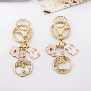 Japanese style golden alloy keychains with pink cherry blossom and rabbit pendants