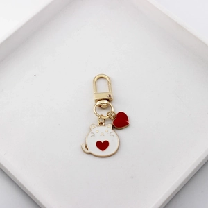 Cute cartoon alloy cat keychain with red heart charms on a sleek golden metal hook