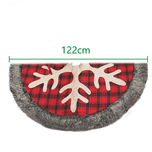 Red and black plaid Christmas tree skirt with gray faux fur trim and snowflake patterns