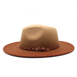 Detail of wool fedora hat featuring two-tone brim and leather band with gold rivets