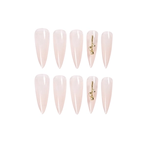 Long stiletto press-on nails in nude pink with 3D golden rose floral charms, 10-piece set