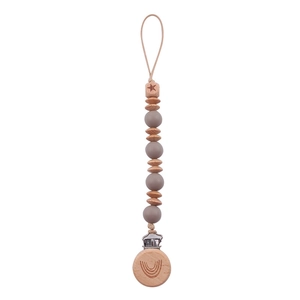 Detail of baby pacifier clip with gray silicone beads and engraved wooden rainbow clip
