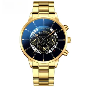 Macro view of gold quartz watch face with blue sunray dial and calendar display