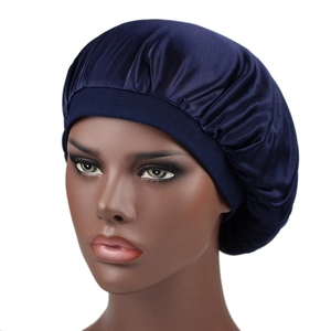 Detailed close-up of a smooth dark blue silky satin bonnet on a mannequin head