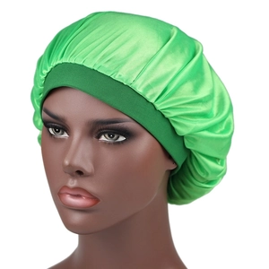 Detail of lime green silky satin sleeping bonnet with elastic wide band on mannequin